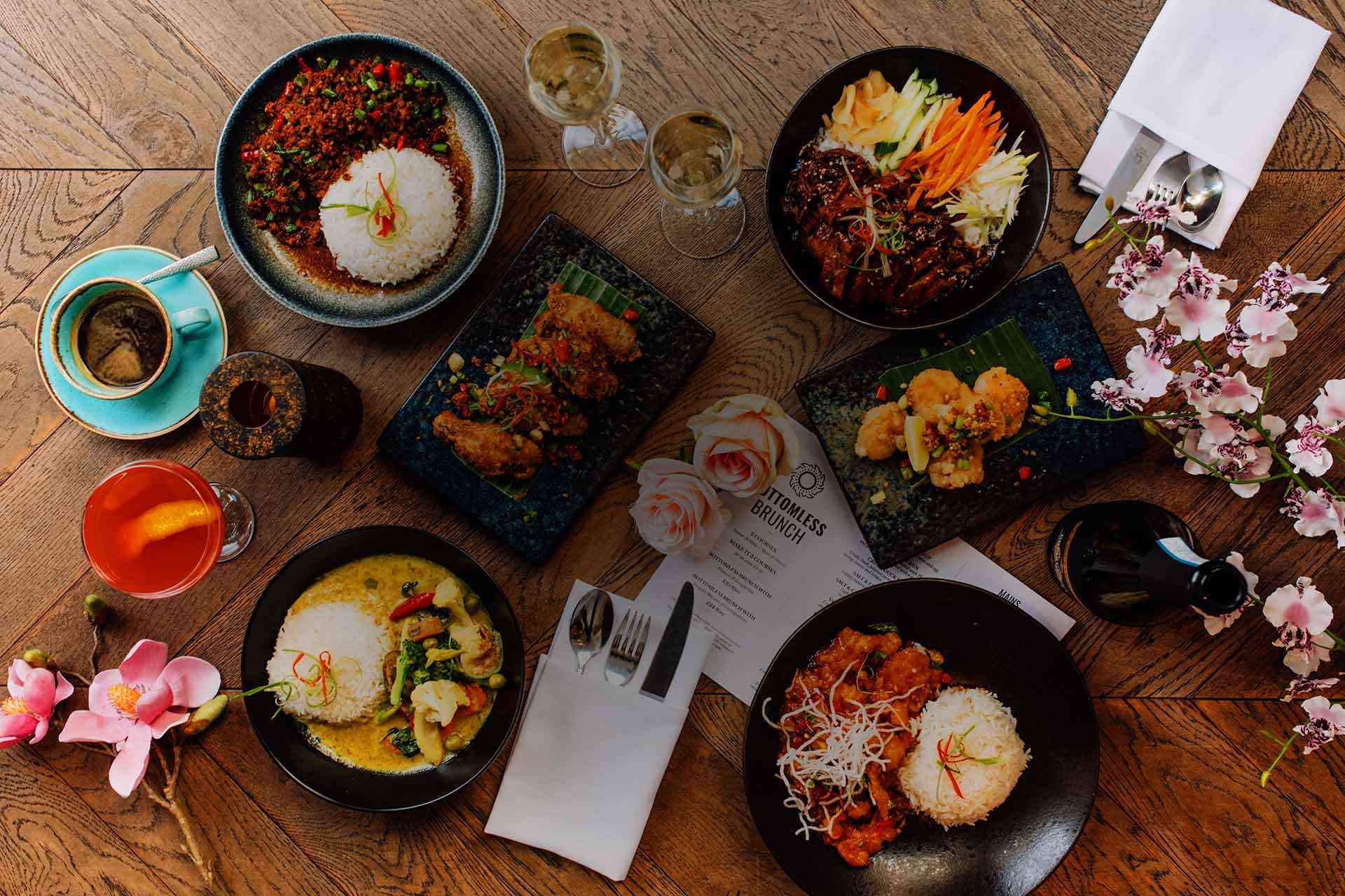 A spread of Thai dishes, curries and rice bowls at Siamais