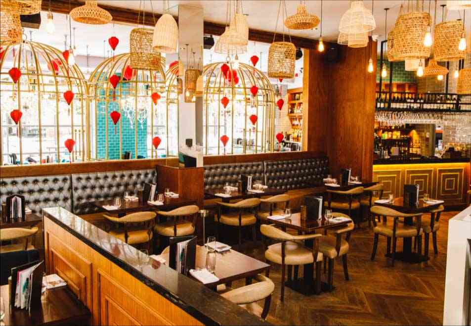 Siamais dining room with birdcage booths, red hearts and hanging lanterns