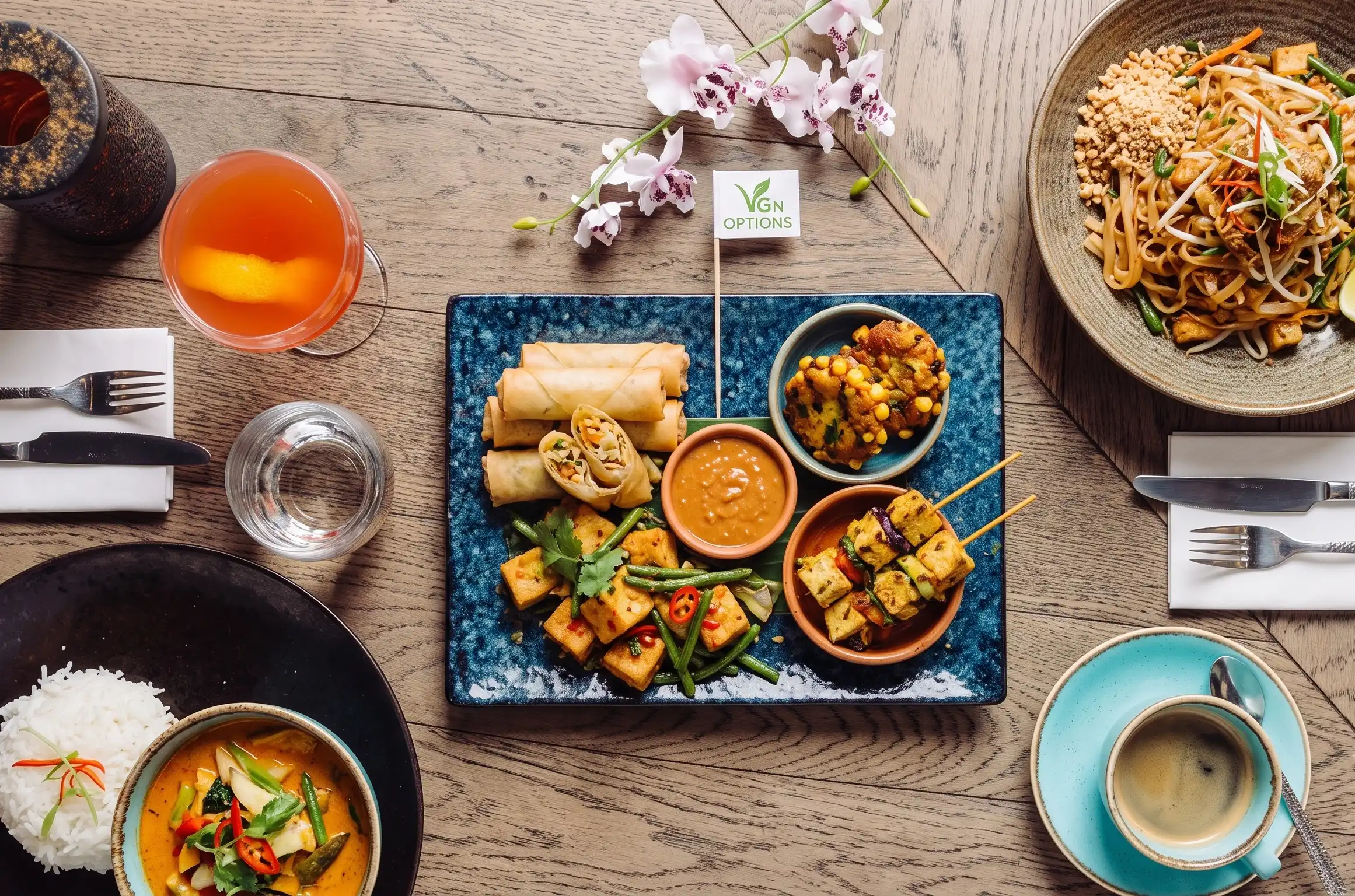 A vegetarian platter with spring rolls, tofu and satay at Siamais
